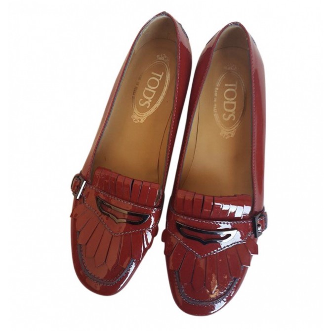 Tod’s patent leather fringed red mocassins 